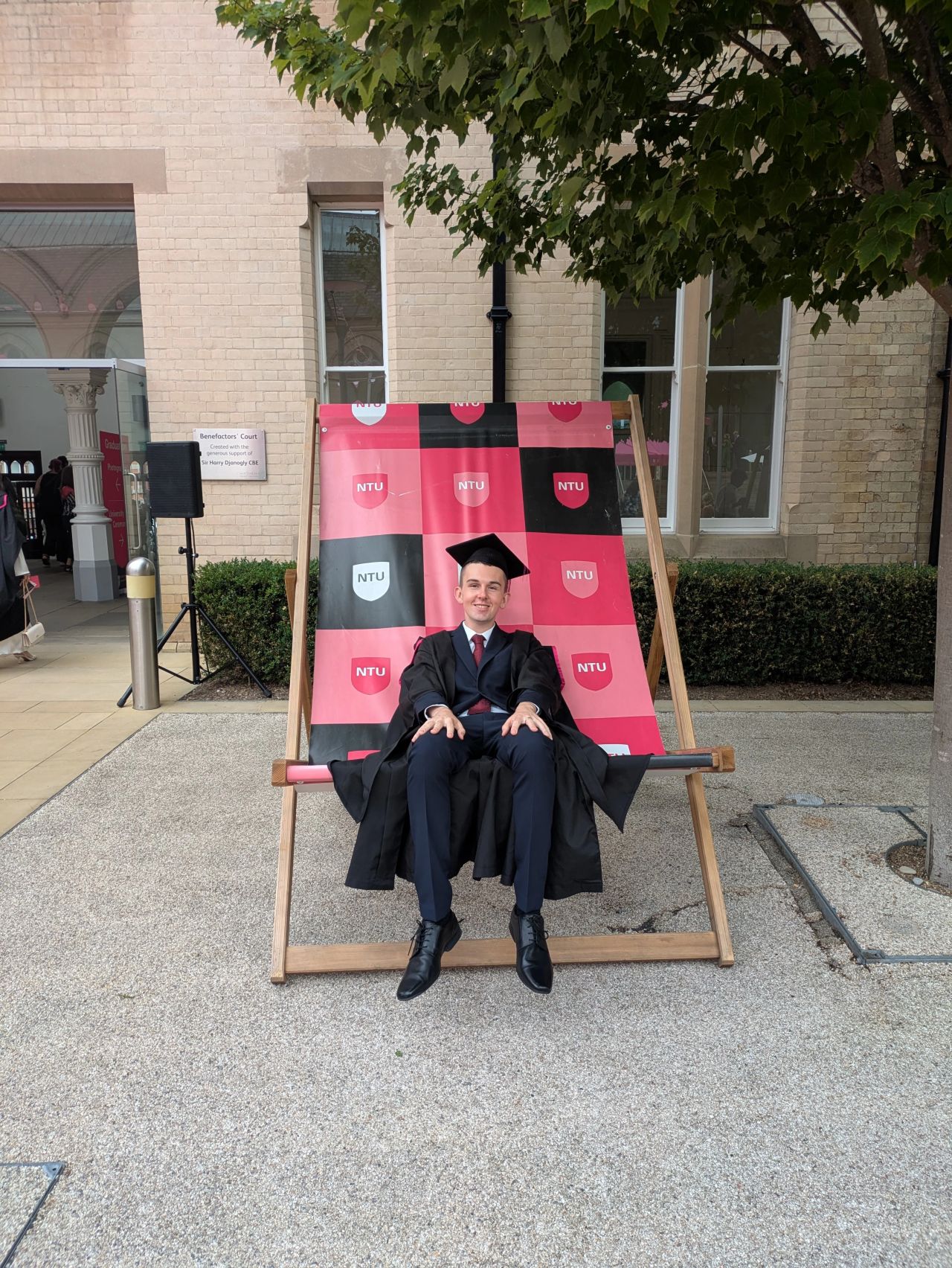 Graduate on large NTU lounge chairs