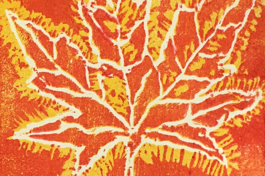 A yellow leaf printed onto an orange background