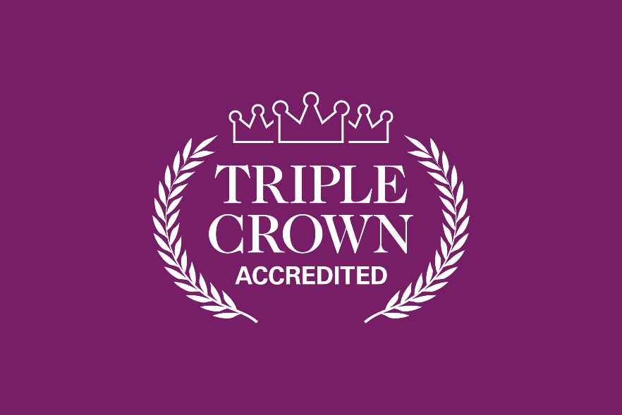 The words 'Triple Crown accredited' within laurel wreaths and with three crowns above