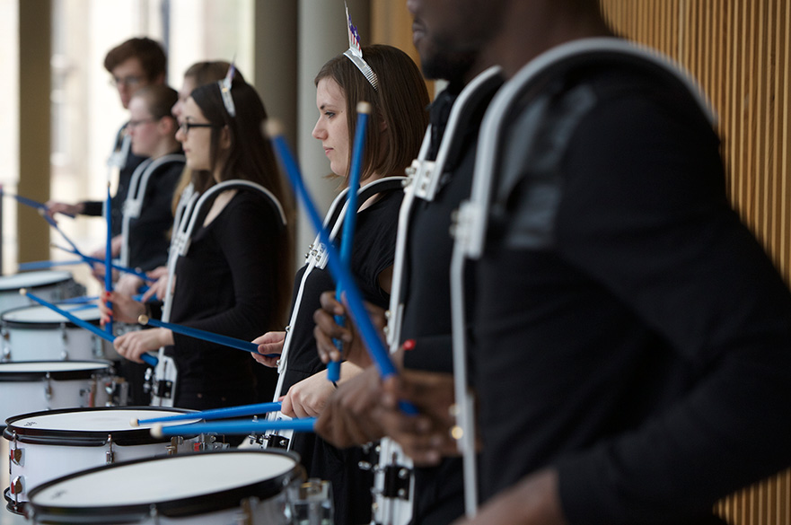 Students playing drums