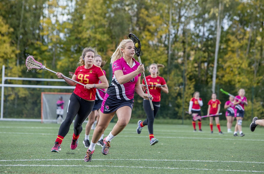 NTU Female Lacrosse Player running