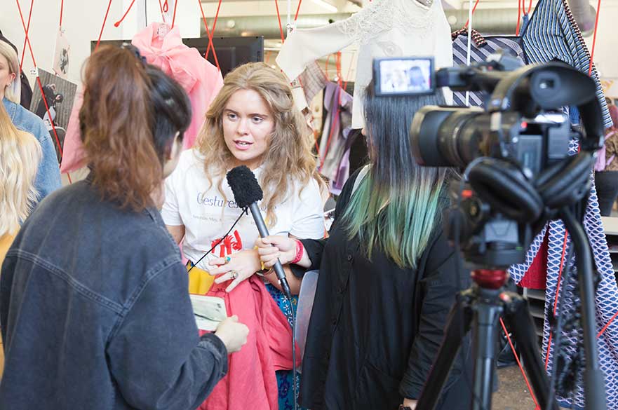 Students being interviewed on the NTU stand at Graduate Fashion Week