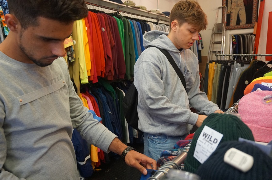 Males students in a clothes shop