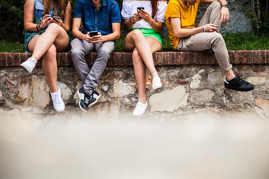 Young people on mobile phones