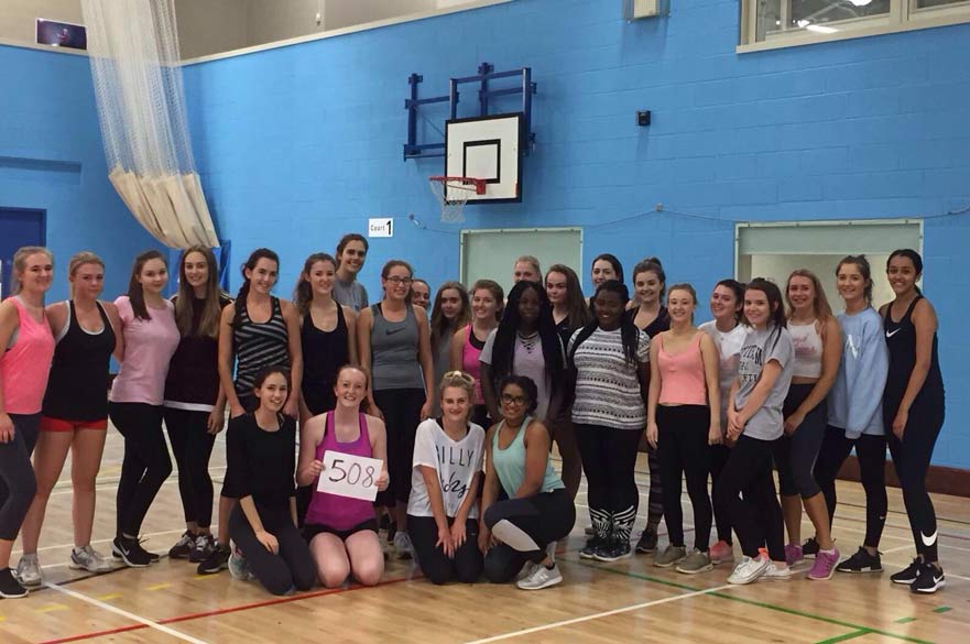 Attendees of the Netball Play for Fun Session holding up a '508' banner