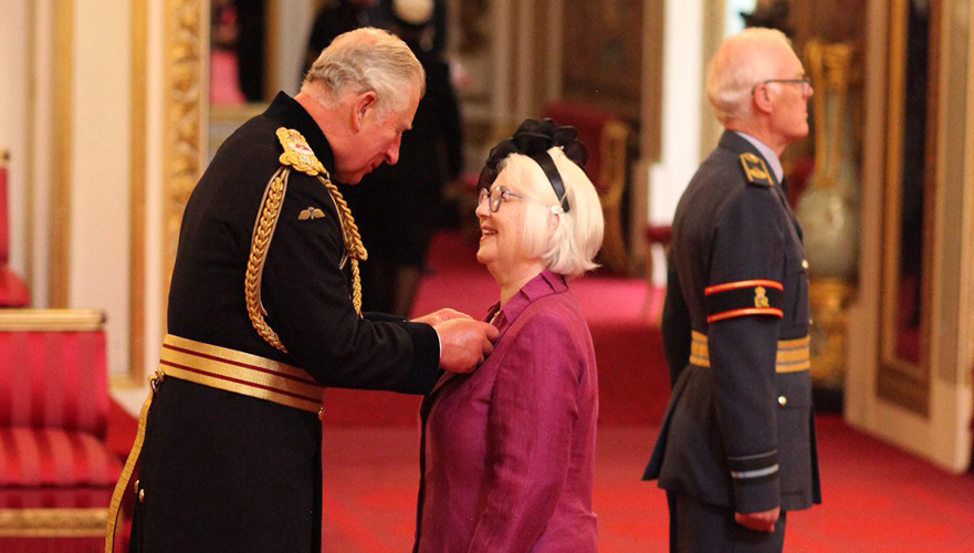 Joan Salter receiving her MBE