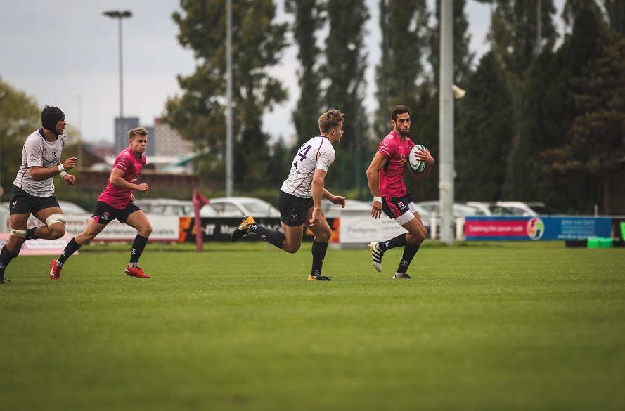 NTU Rugby Union player with the ball in hand.