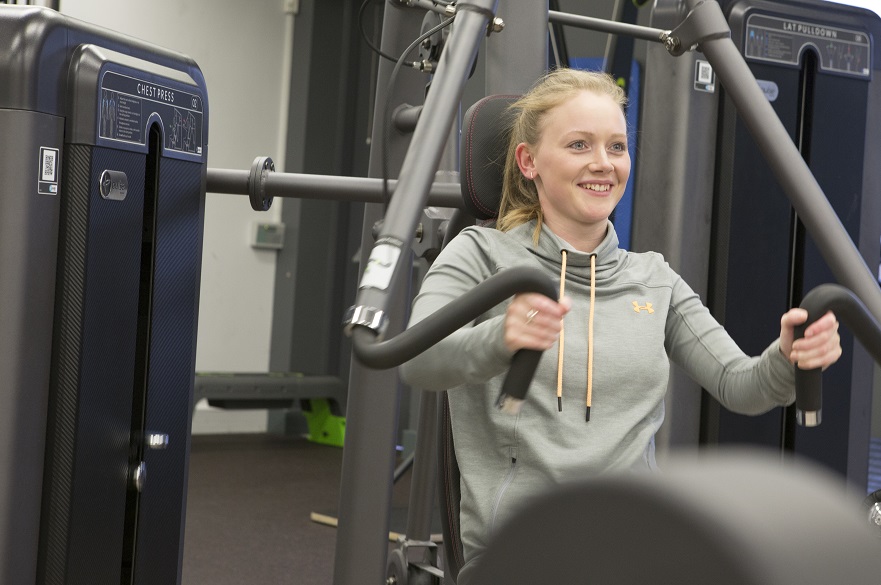 female using gym equipment