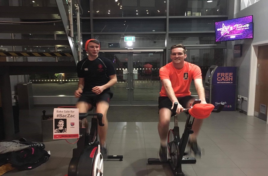 NTU cricket players completing a charity bike ride