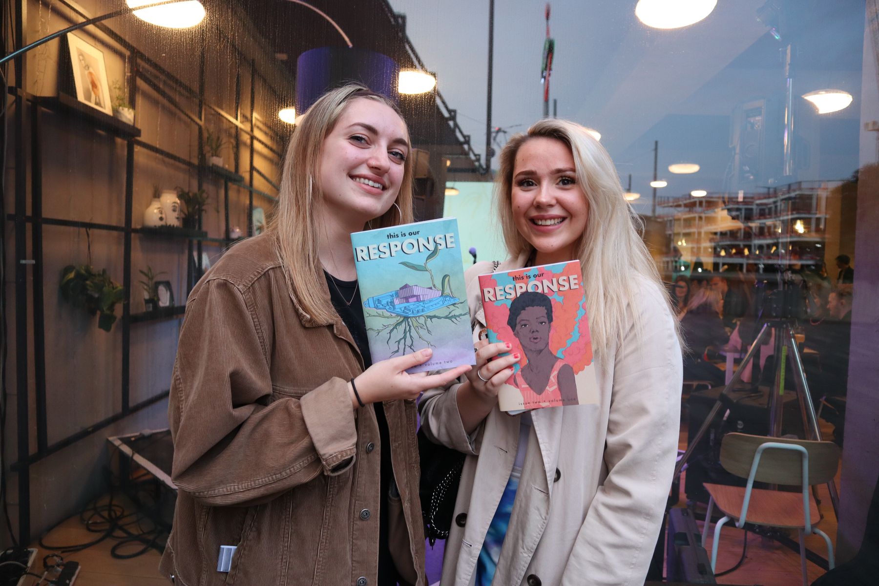 Students holding copies of the RESPONSE publication