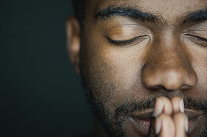 Black man praying