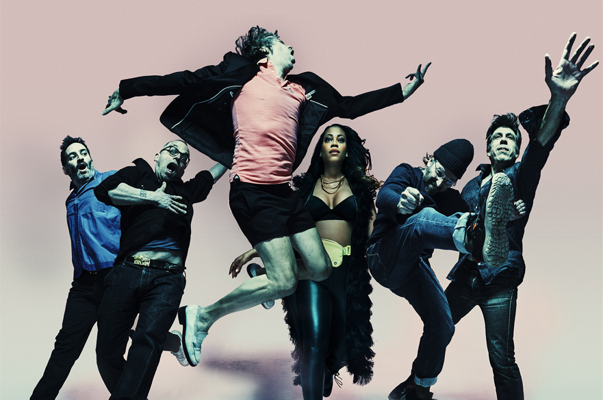 A photo of the band jumping