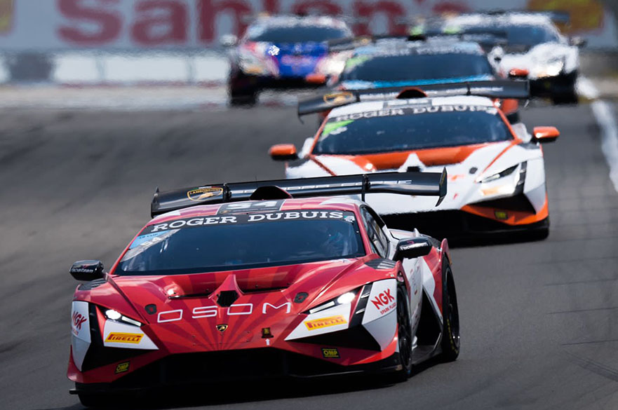 Racing car driving around track