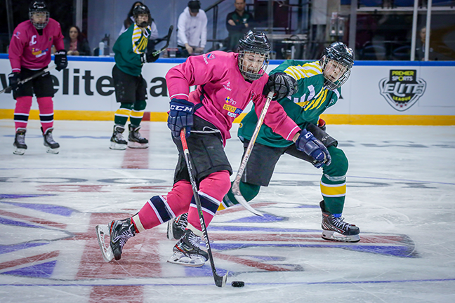 Ice hockey players playing in the Varsity ice hockey match