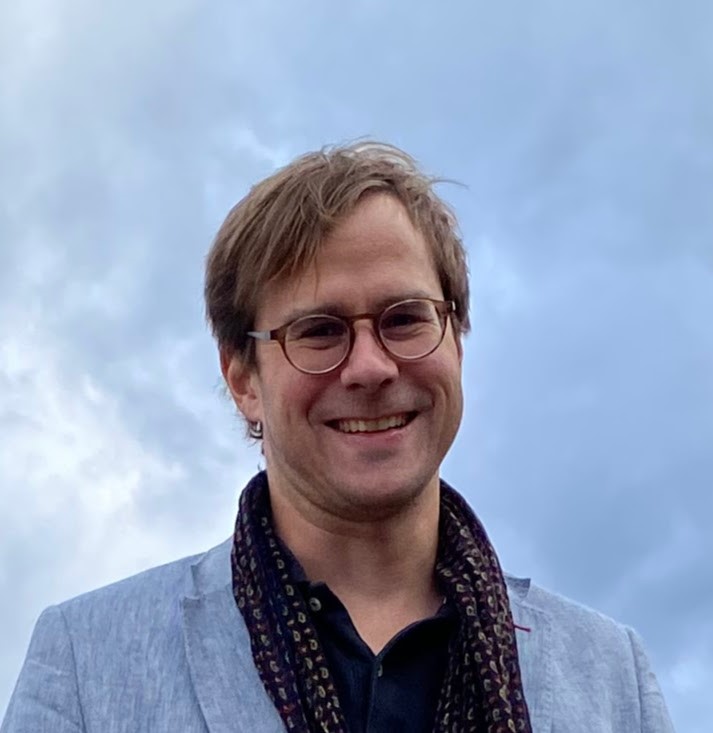 Man with glasses outdoors