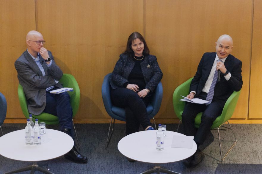Professor Will Rossiter, Claire Ward and Aki Takehisa sitting in chairs having a conversation