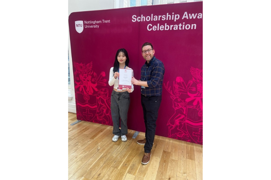 Eun-Gyeol Park with Dave Berry holding Scholarship Certificate