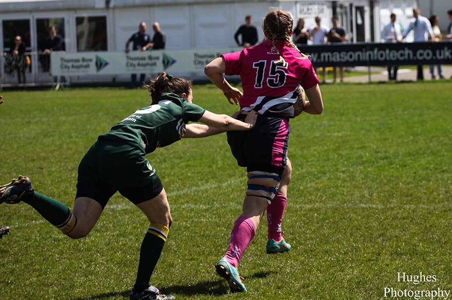 Rugby tackle in progress