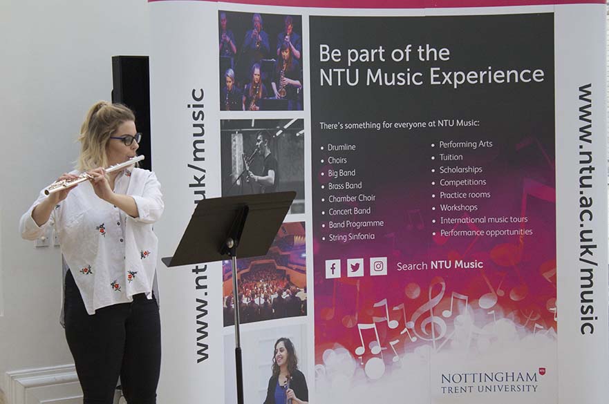 Student playing the flute in Lunchtime Concert