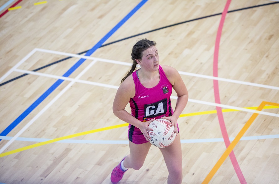 NTU Netball player with ball in hand
