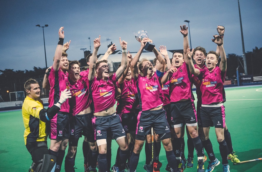NTU Men's Hockey team lift trophy in celebration of winning 2018 Varsity fixture