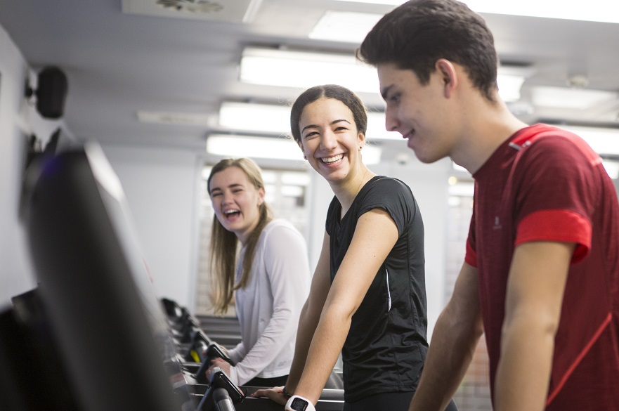 friends laughing in the gym 
