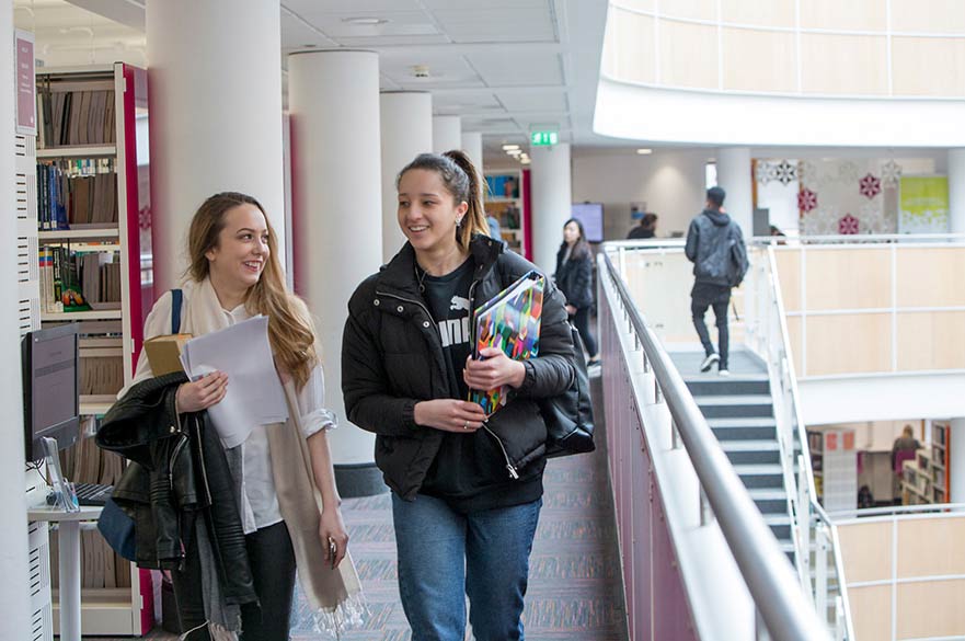 Students walking library