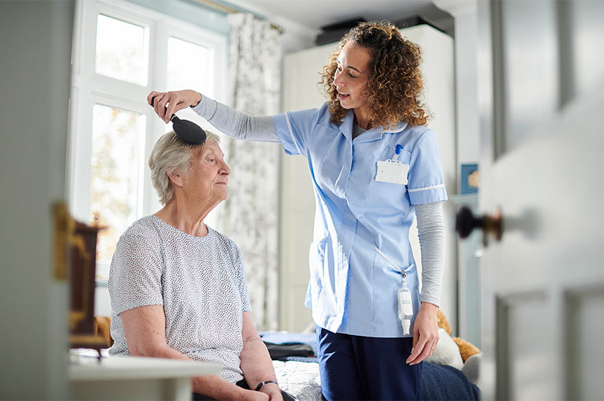 Nurse attending to patient