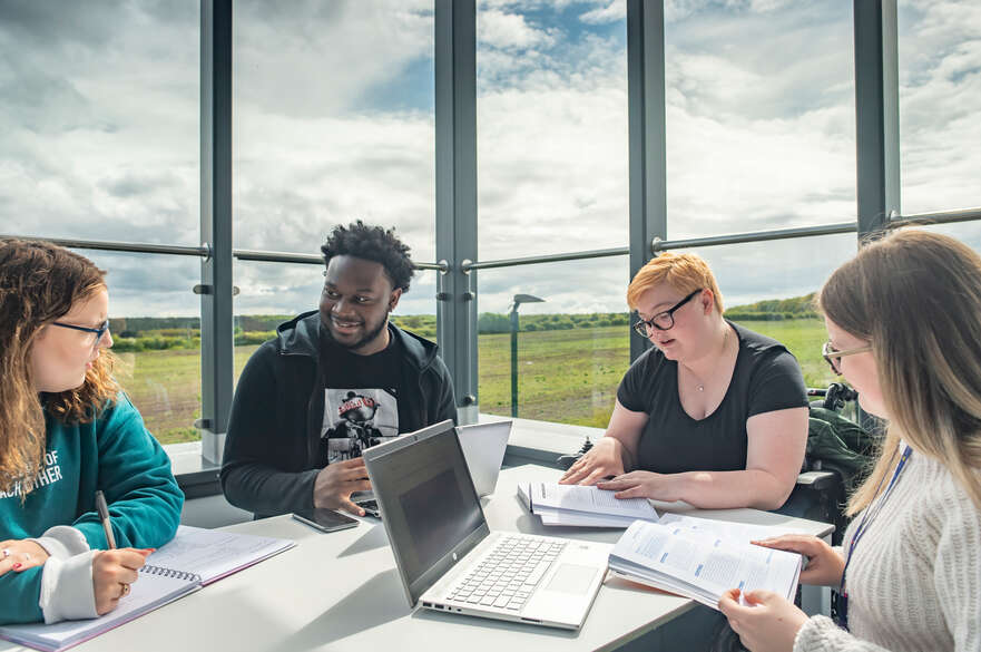 Students sat studying in Mansfield campus building