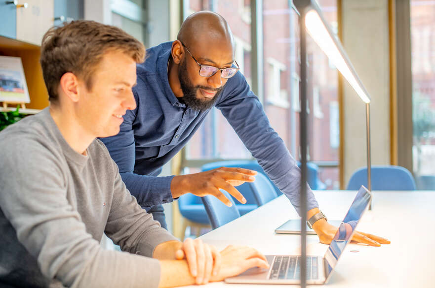 Man pointing at computer screen 