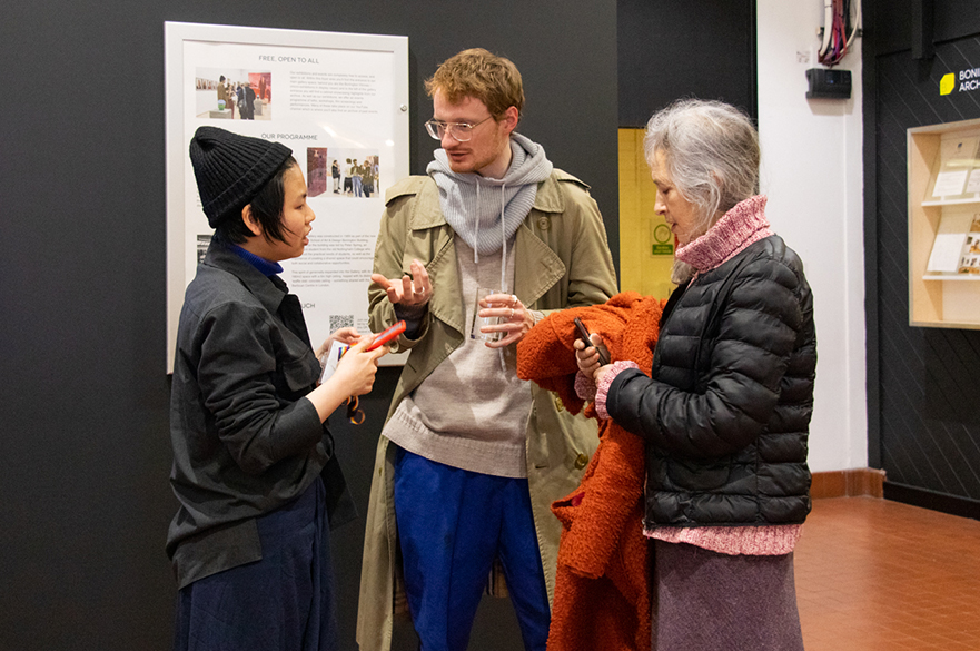 Three people chatting at a Bonington Gallery Launch Event