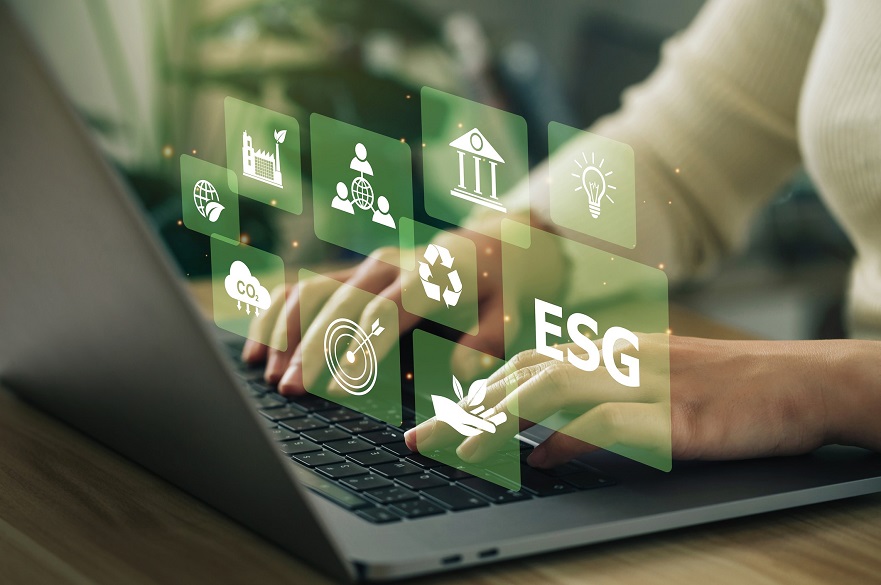 ESG investment graphic of hands on a computer with ESG logos