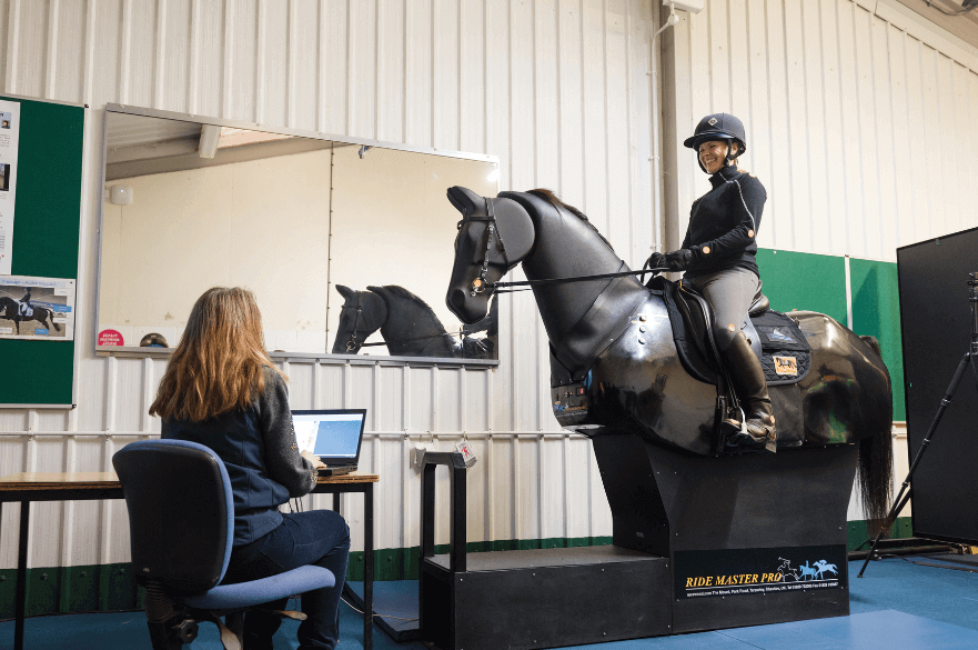 Student on a mechanical horse in our Performance Analysis Room on Brackenhurst Campus