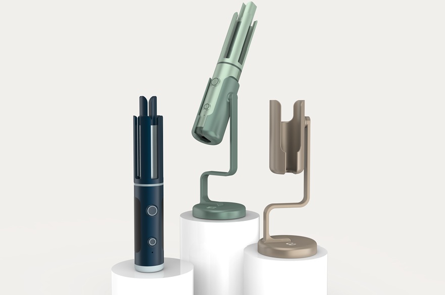 A new hair curling product and its stand mounted on three plinths against a white background.