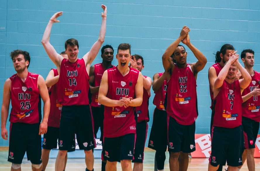 Men's Basketball Team celebrating