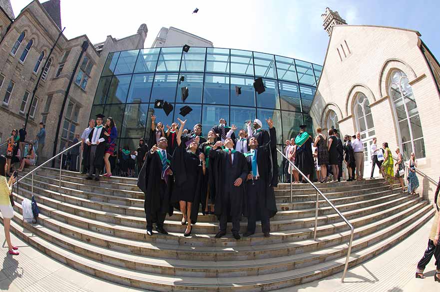 Graduates throwing caps