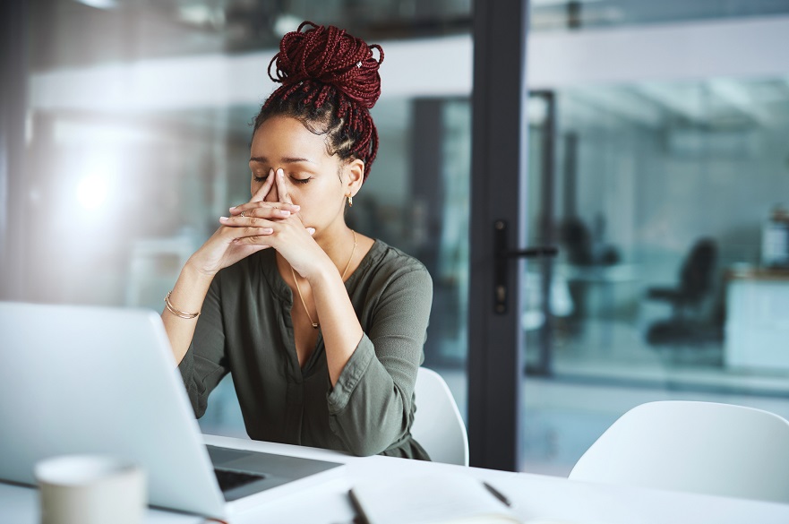 Woman looking ill at a computer