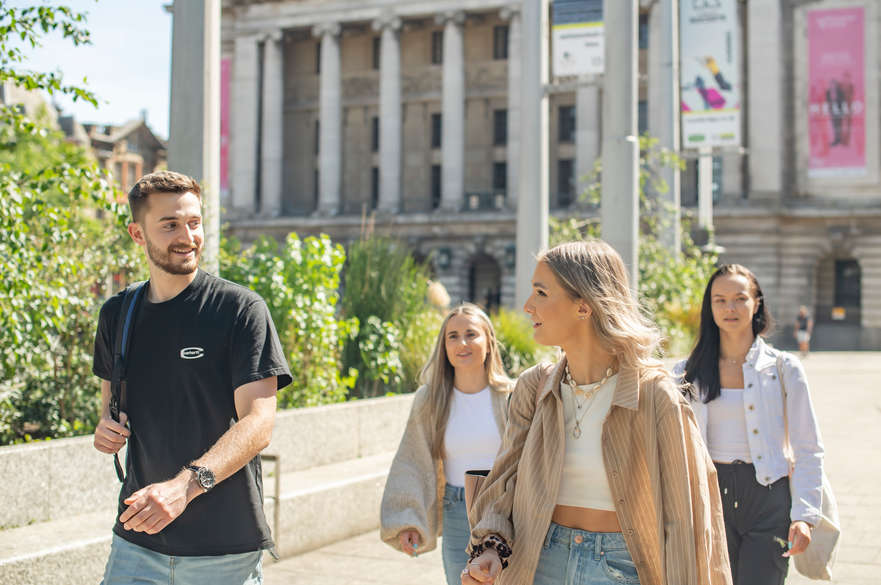 Students walking past Old Market Square