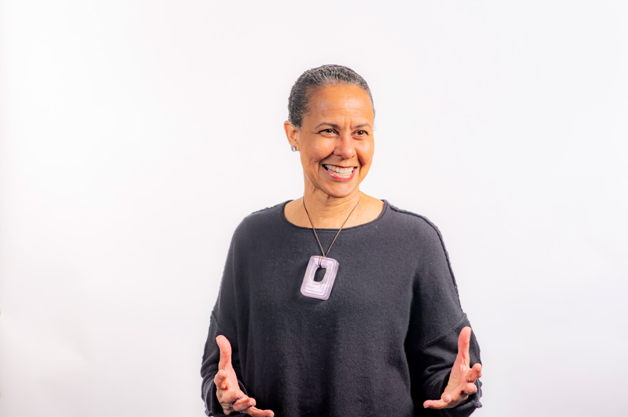 Image of Senior Lecturer Deanne Bell smiling in front of a white background