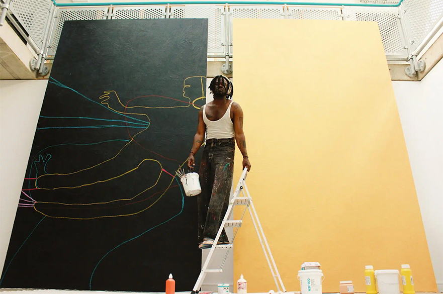 A man on a step ladder in front of a large painting.