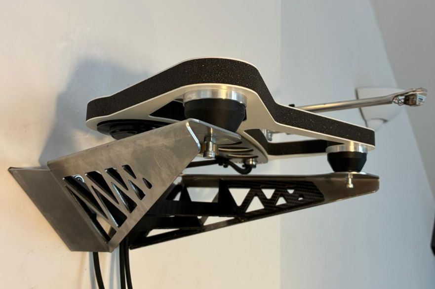 A wall bracket with a record player on it.