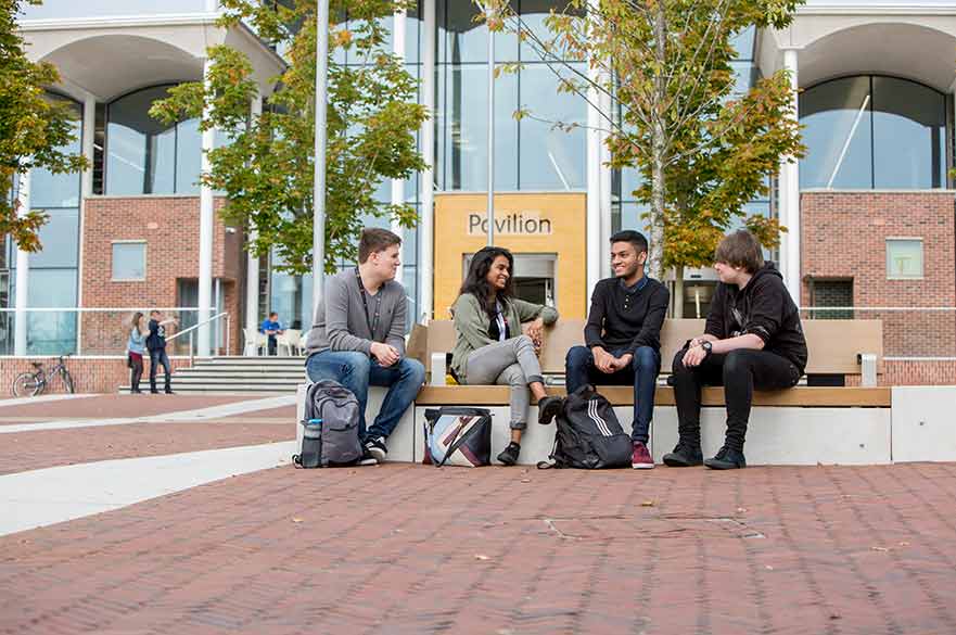 Students sitting outside Pavilion