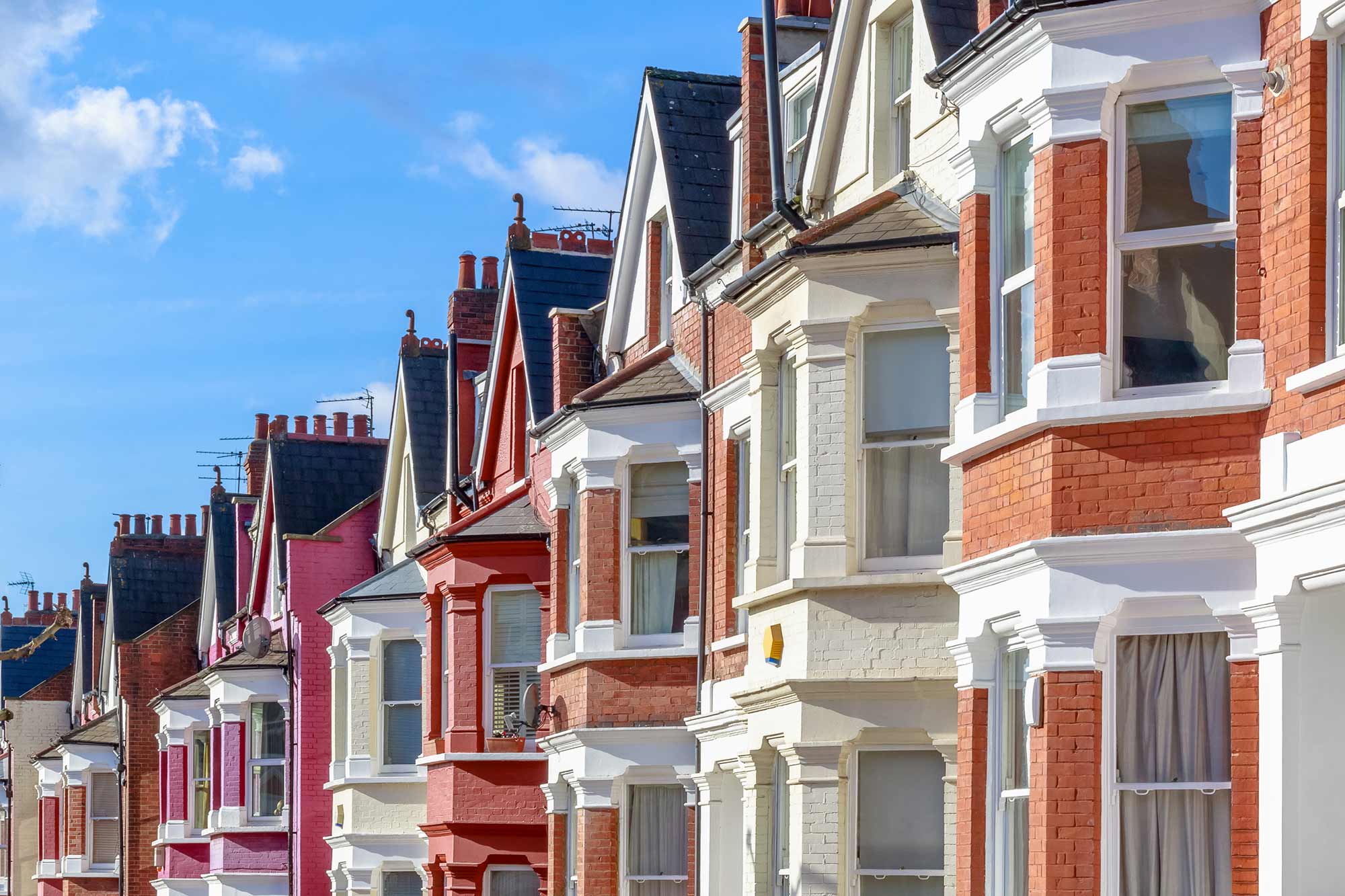 A row of houses, each painted in different colours