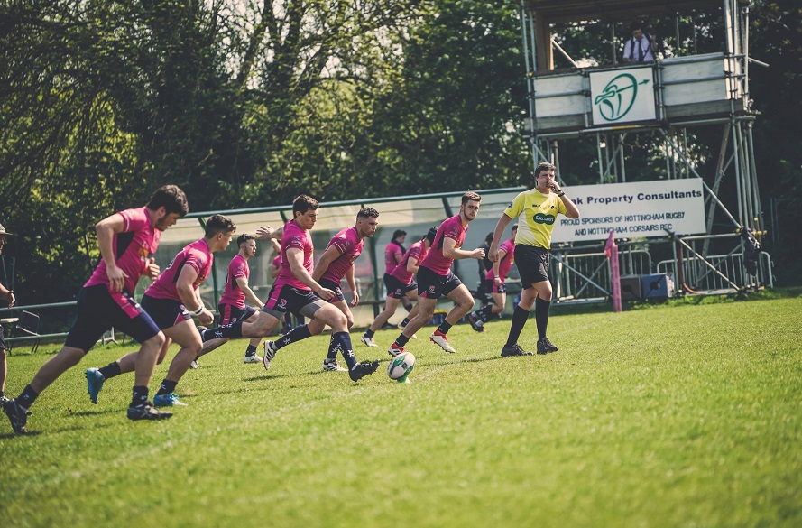 NTU Rugby league players kick off and run towards the opposition