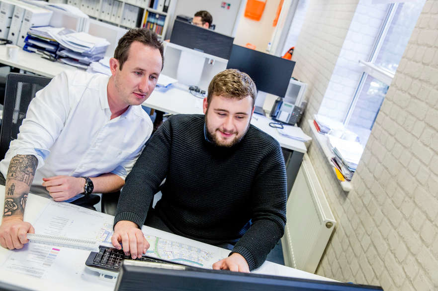 Two men at a desk