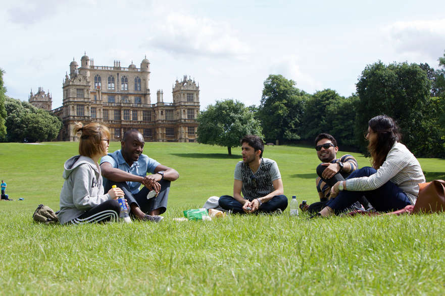 Group of students sitting in a park