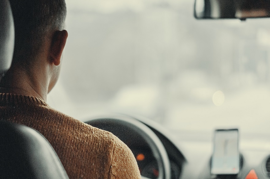 Back of a taxi driver's head