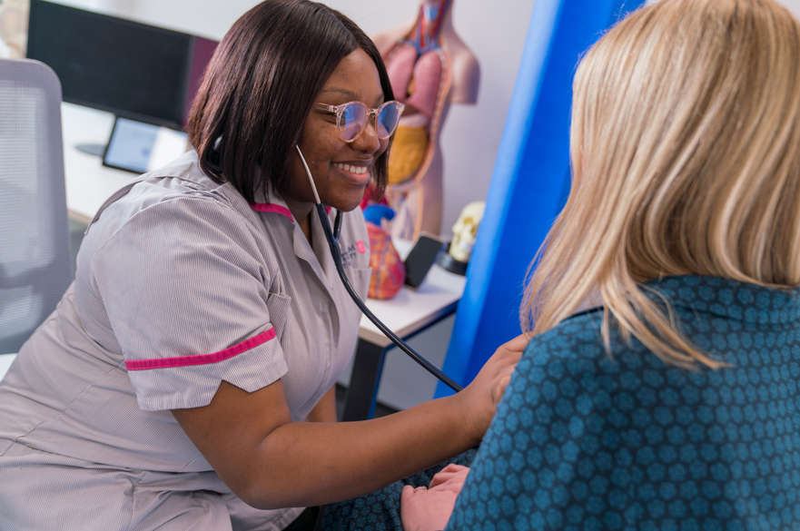 Nursing student undertaking practical scenario