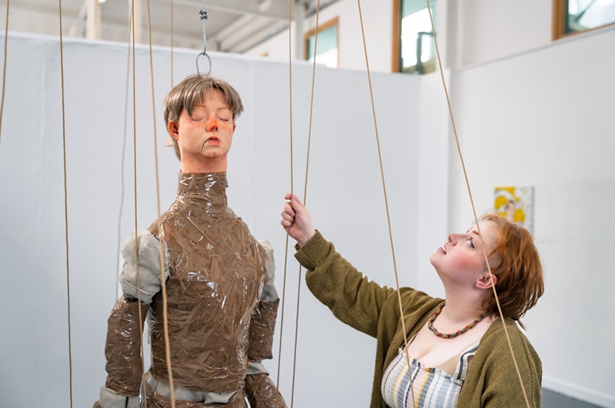 Cerys Sleith with her artwork puppet