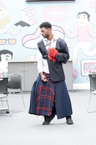 A model posing in one of Daisy's skirts